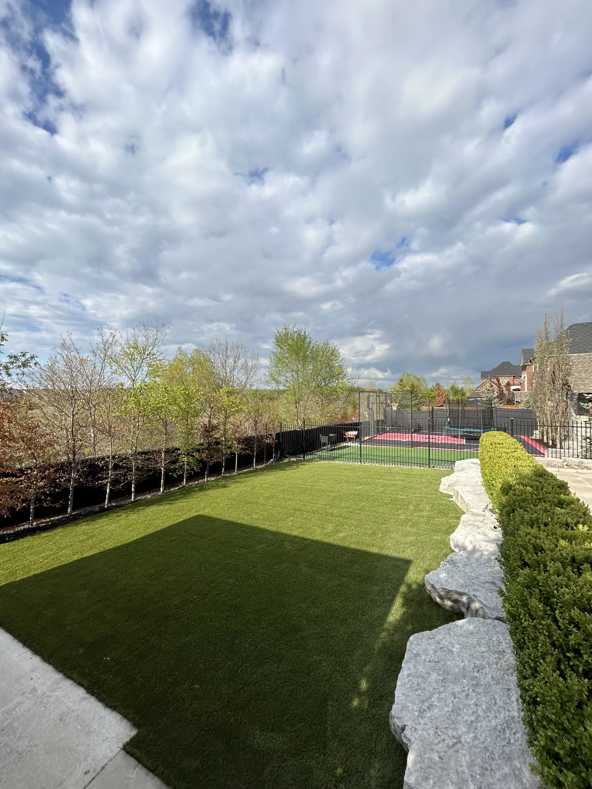 Backyard artificial grass installation in Brampton